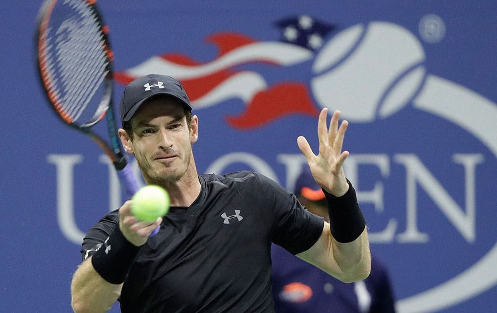 Andy Murray, of Britain, returns a shot to Lukas Rosol, of the Czech Republic, during the first round of the U.S. Open tennis tournament in New York Andy Murray, of Britain, returns a shot to Lukas Rosol, of the Czech Republic, during the first round of the U.S. Open tennis tournament in New York