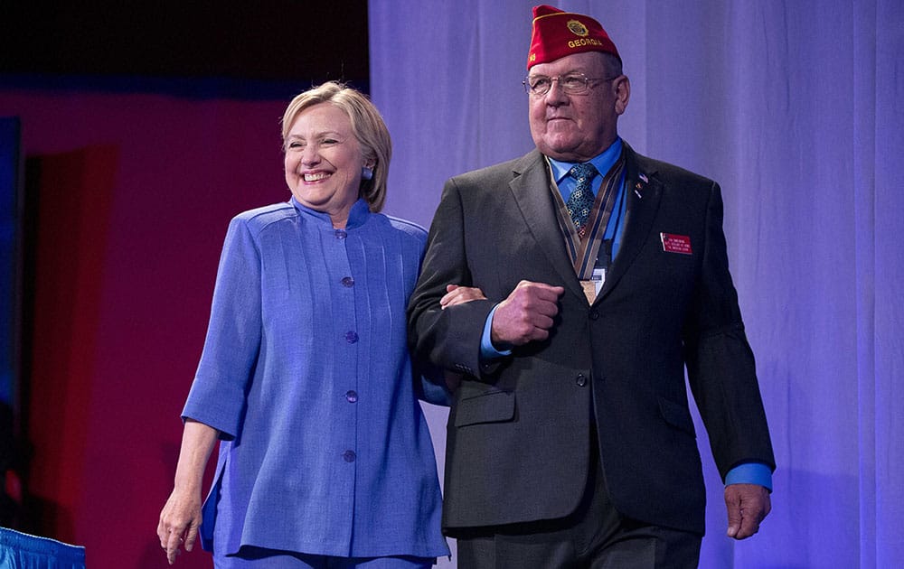 Hillary Clinton, escorted by Daniel Zimmermann, National Sergeant-at-Arms, arrives to speak at the American Legions 98th Annual Convention Hillary Clinton, escorted by Daniel Zimmermann, National Sergeant-at-Arms, arrives to speak at the American Legions 98th Annual Convention