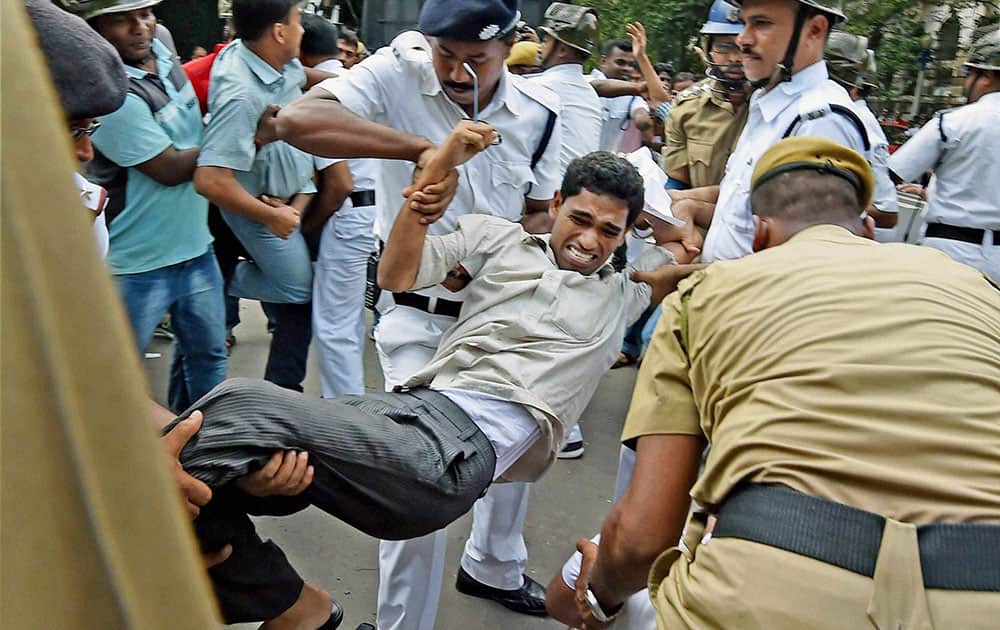 Police detain a SUCI activists during their agitation to protest against gangrape and murder of a 12 years old pavement girl Police detain a SUCI activists during their agitation to protest against gangrape and murder of a 12 years old pavement girl