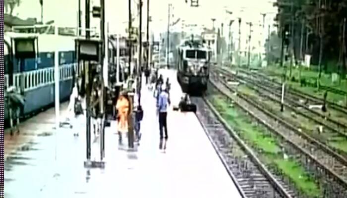 SHOCKING! This woman tried to cross railway track in front of speeding train - WATCH what happened next