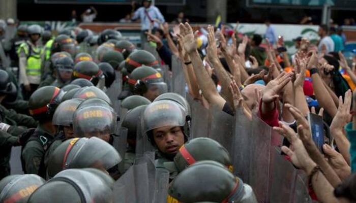 After huge Venezuela protest march, government says foils coup