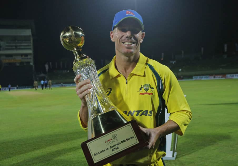 David Warner poses with the series trophy