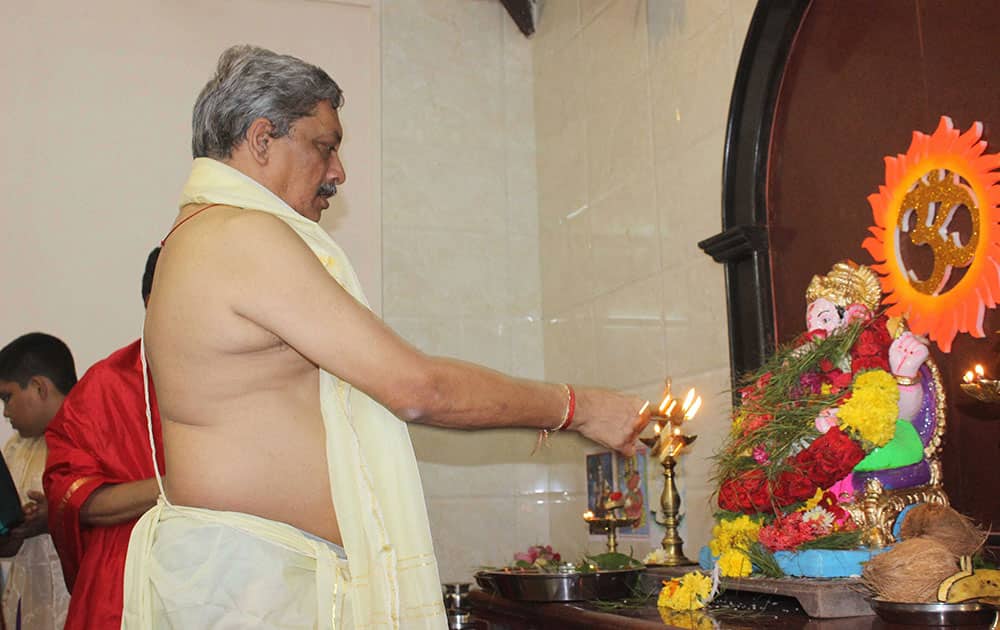 Union defence Minister Manohar Parrikar worshipps Lord Ganesh at his ancestral house near Mapusa, Goa