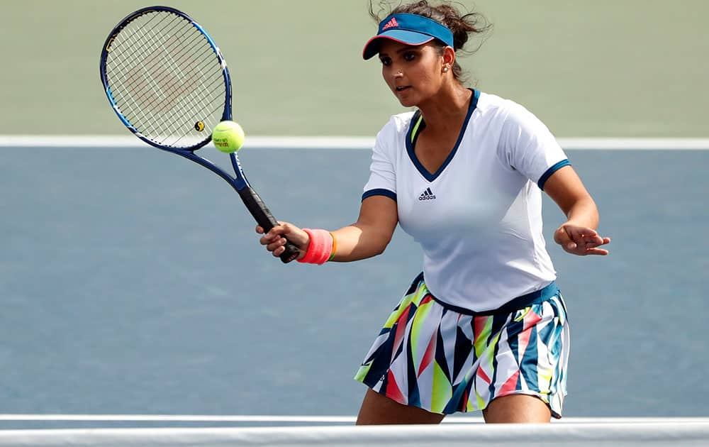 Sania Mirza returns a shot during a womens doubles match in the third round of the US Open tennis tournament in New York