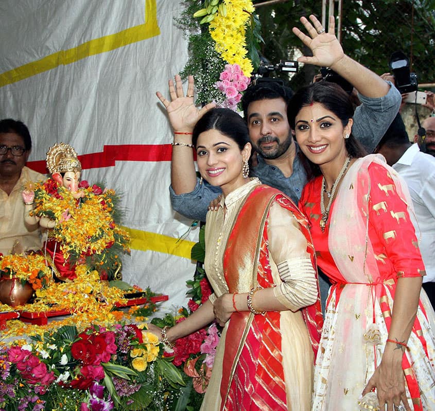 Bollywood actor Shilpa Shetty with husband Raj Kundra and Shamita Shetty participate in a procession for the immersion of an idol of Lord Ganesha