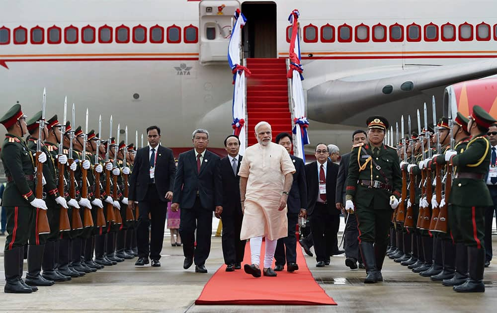 Prime Minister Narendra Modi is welcomed upon his arrival at Vientiane International airport in Laos