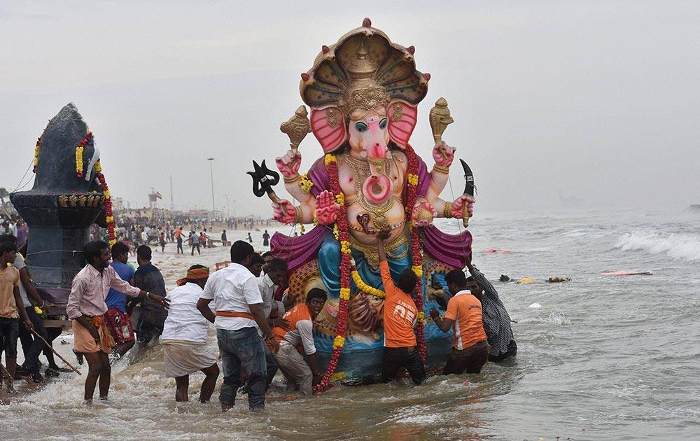 Devotees immersing an idol of Lord Ganesha