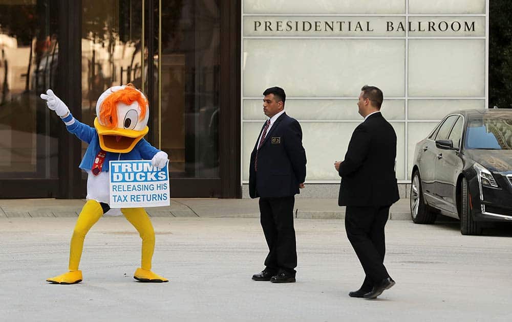 A demonstrator wearing a Donald Duck costume