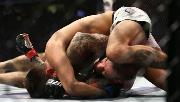 WATCH! WWE superstar CM Punk absolutely destroyed on his UFC debut by Mickey Gall