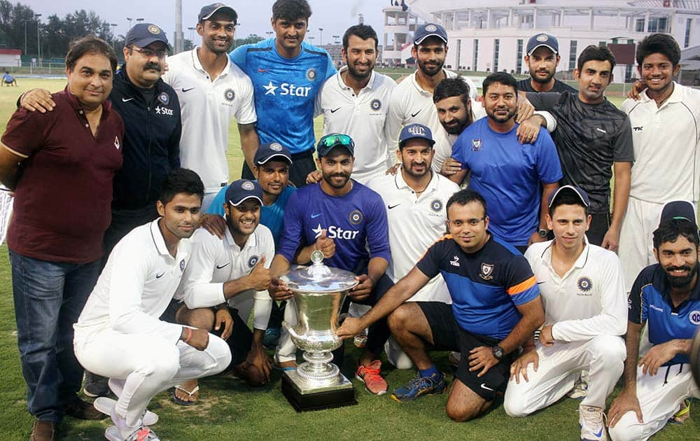 India Blue players jubilate with the Duleep Trophy