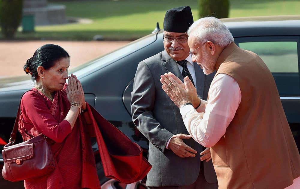Prime Minister Narendra Modi greets Nepalese counterpart Pushpa Kamal Dahal and his wife Sita Dahal during a ceremonial reception