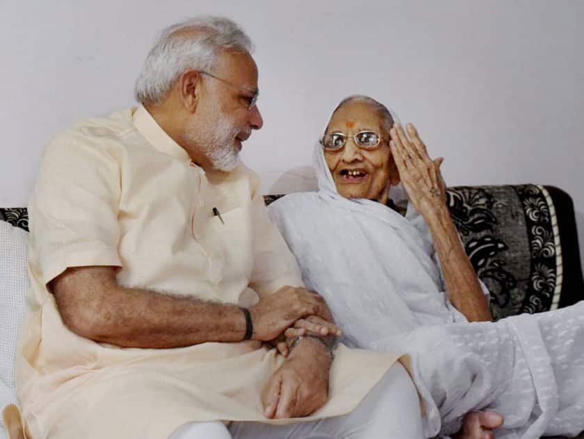 Narendra Modi takes blessings from his mother Narendra Modi takes blessings from his mother