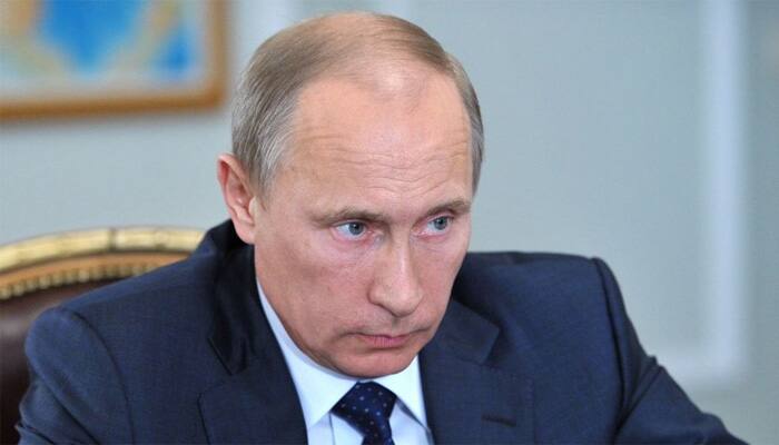 Russian holds parliament vote with little threat for Putin