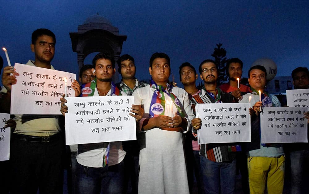 Lok Janshakti party activists during a candle light vigil pray for soldiers killed in a terror attack at an army administrative base in Jammu and Kashmi