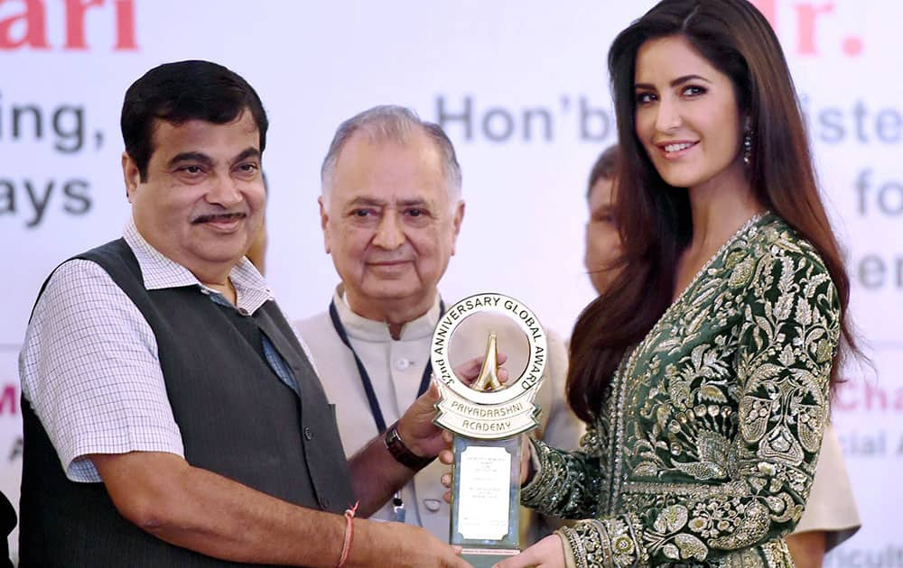 Nitin Gadkari, Union Minister for Shipping, Road Transport and Highways honors Bollywood actress Katrina Kaif with the Smita Patil Memorial award during the Priyadarshni Academy Global awards ceremony