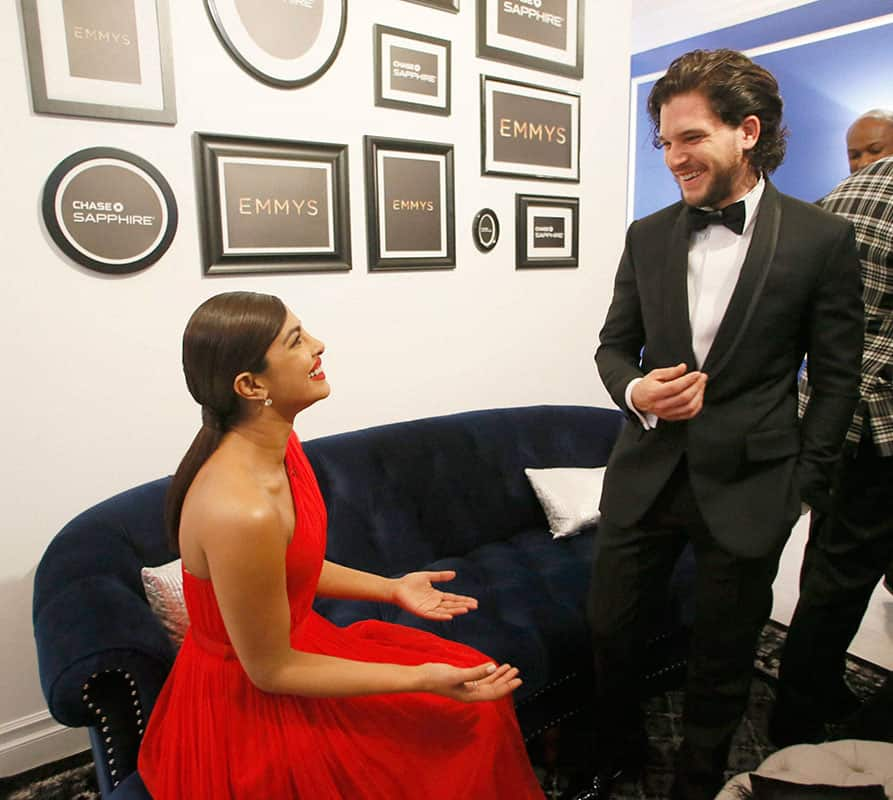 Priyanka Chopra, left, and Kit Harington pose backstage at the 68th Primetime Emmy Awards