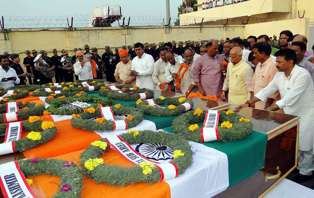 People pay homage to seven army soldiers who were killed in the Uri attack, at Babatpur Airport in Varanasi