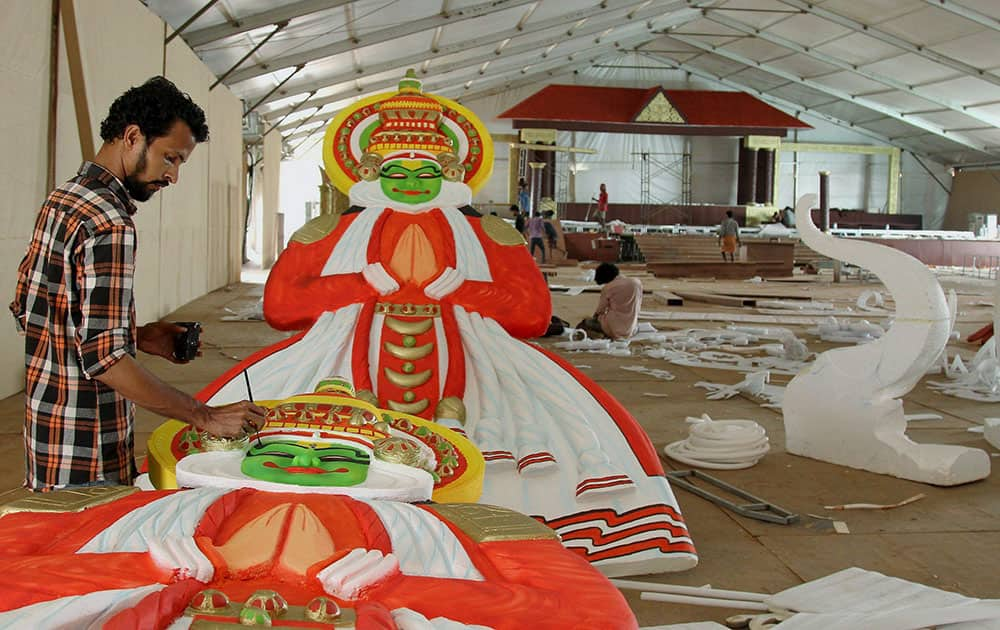 Labourers work as they prepare for BJP National Executive Meet in Kozhikode