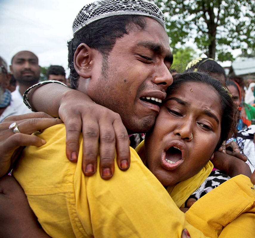 Relatives mourn during the funeral procession of Anjuma Beghum who was killed in clashes with the police during an eviction drive at Kuthori village on the periphery of the Kaziranga National Park