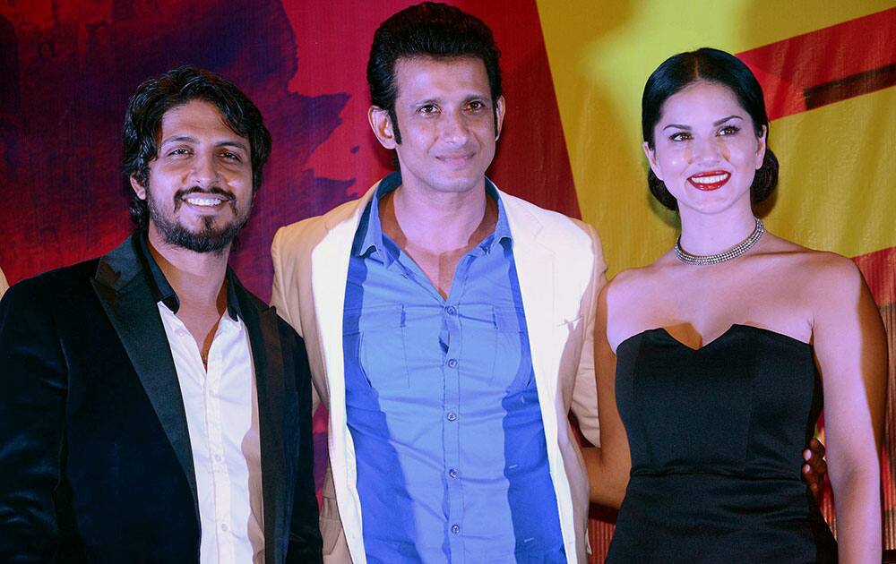 Bollywood actors Sharman Joshi, Sunny Leone with filmmaker Pawan Kumar Sharma during the release of song Tu Zaroorat Nahi Tu Zaroori Hai from film Fuddu