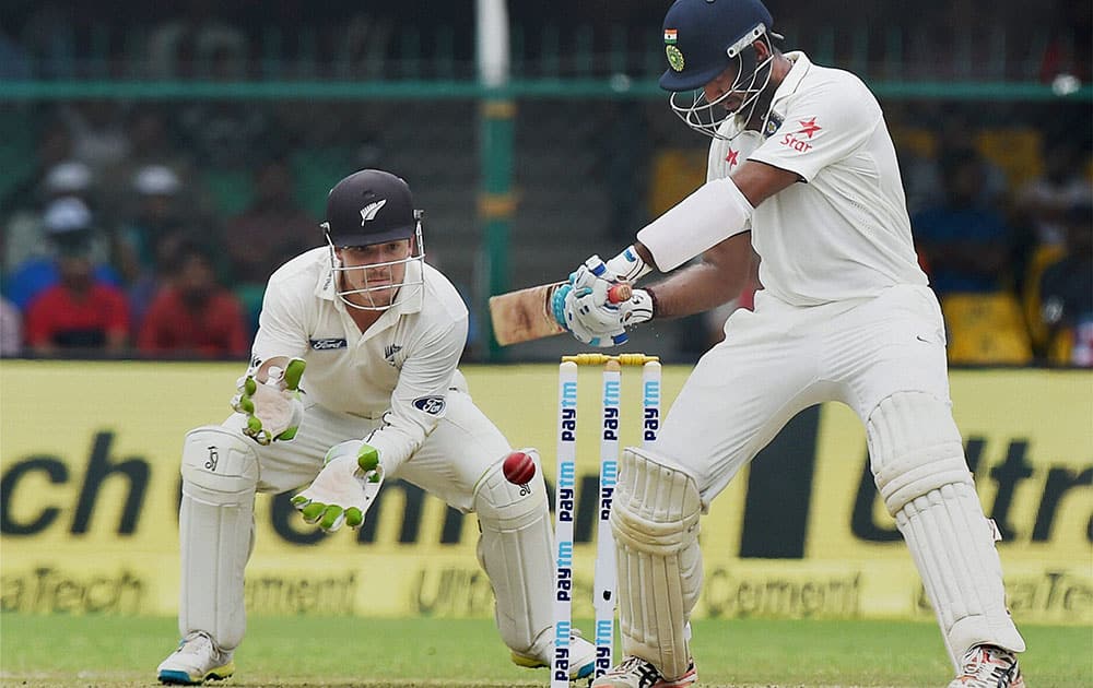 Cheteshwar Pujara plays a shot on the opening day of the first Test match against New Zealand at Green Park in Kanpur