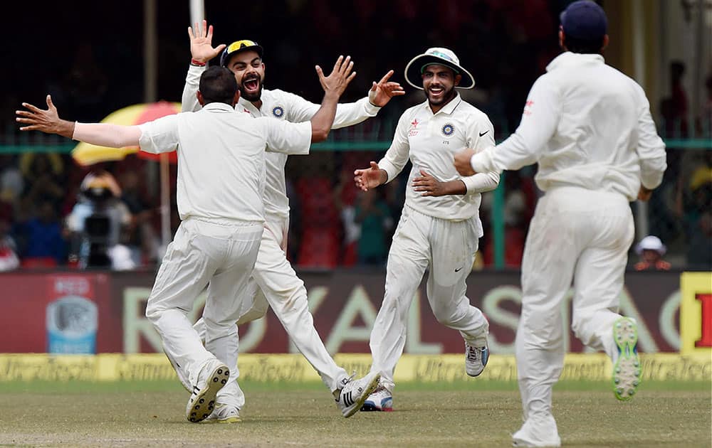 Virat Kohli and Mohammed Sami celebrate the wicket of Bradley-John Watling during the 5th Day of first test match at Green Park in Kanpur