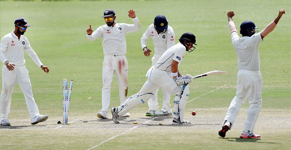 Indian team celebrates victory over New Zealand during the 5th Day of first test match at Green Park in Kanpur