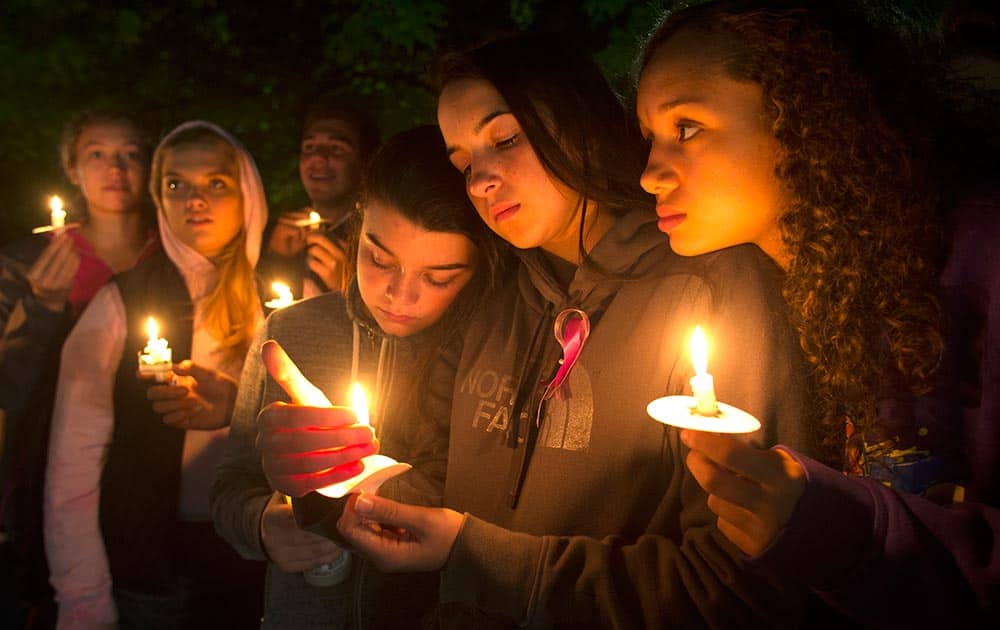 Tatum Sprouse participate in a candlelight vigil
