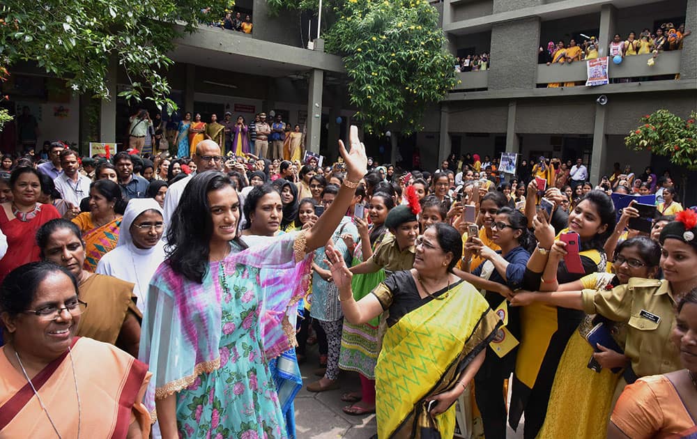 Rio Olympics silver medalist shuttler P V Sindhu being welcomed by students of St. Anns College