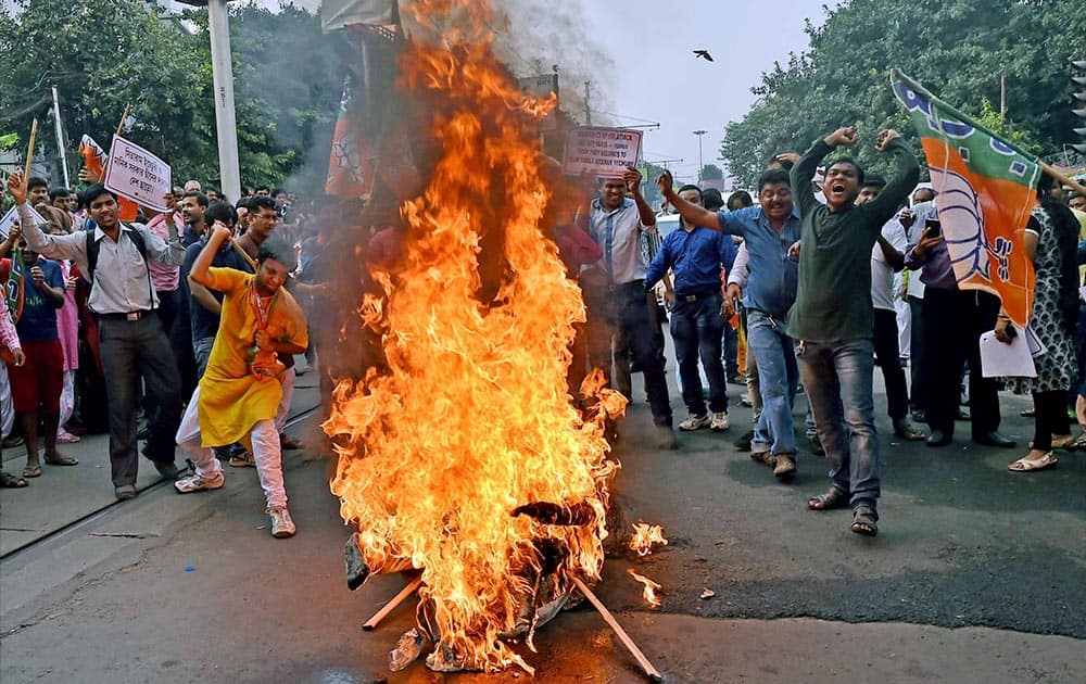 BJP activists burn an effigy of Secretary Sitaram Yehchury