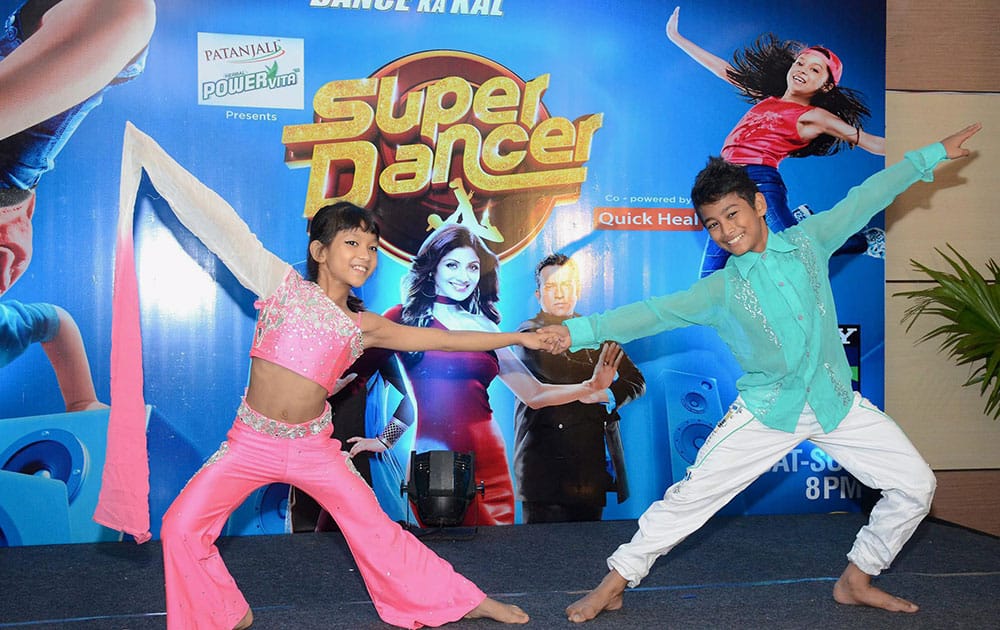 Finalists of a dance reality show Ashish Das and Masoom Narzary perform at a show on their homecoming in Guwahati