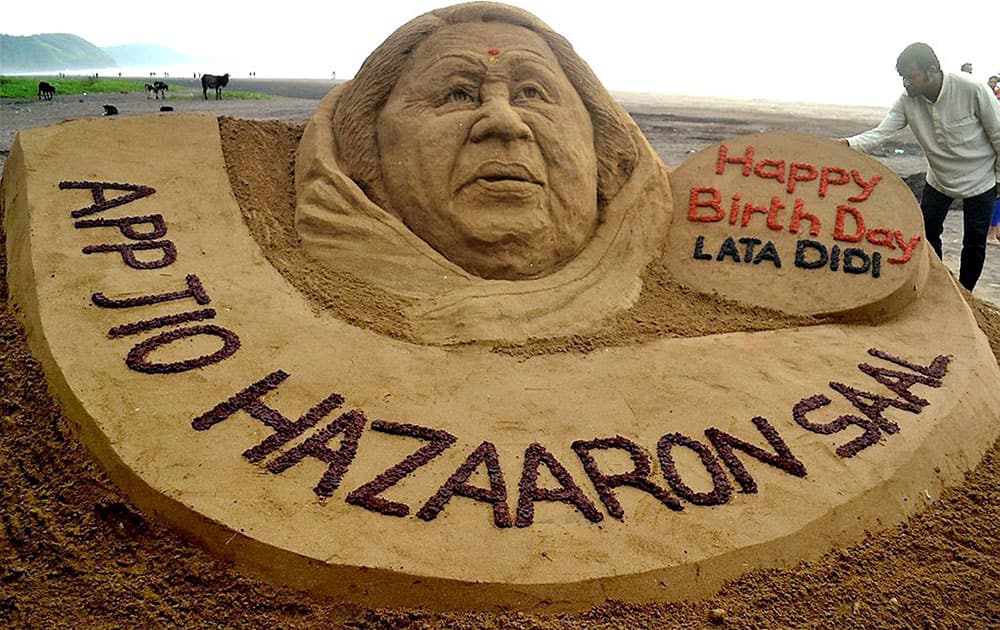 Sand artist Sudarsan Pattnaik creates a sand sculpture to wish legendary singer Lata Mangeshkar on ther 87th Birthday in Ratnagiri District