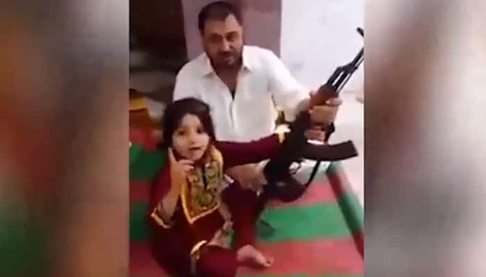 Pakistani father teaches little girl how to fire AK47, makes her threaten PM Narendra Modi; video crashes internet - WATCH