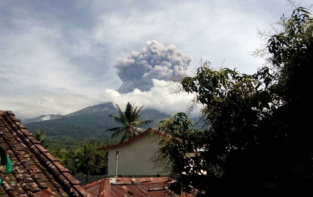 volcanic material from the eruption of Mount Barujari is seen from Bayan, Lombok Island