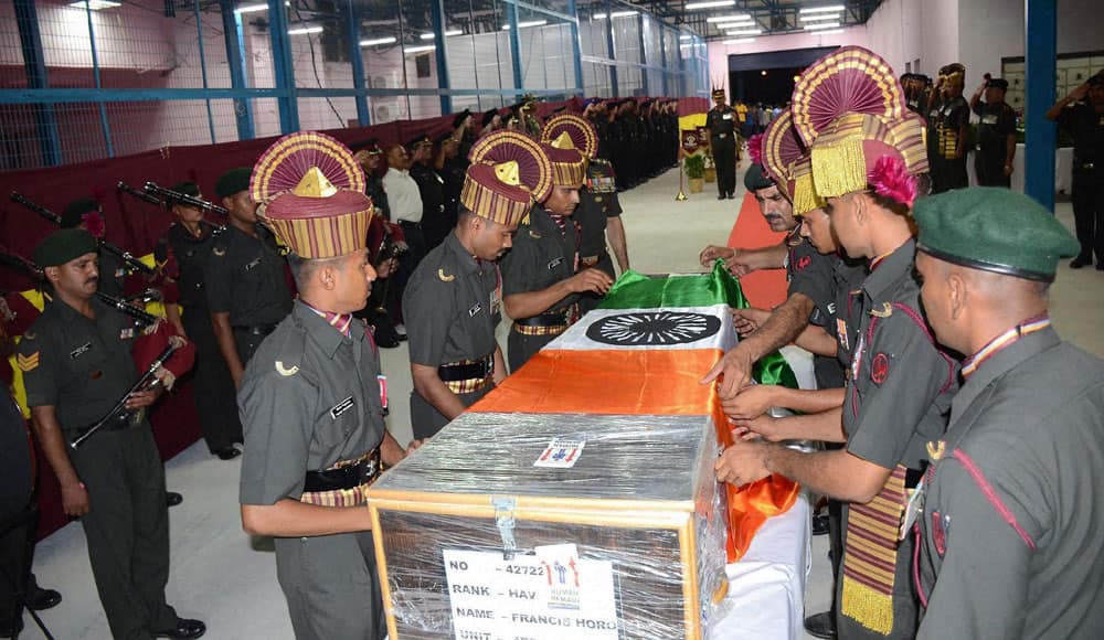 Army personnel with coffin of Martyred Francis