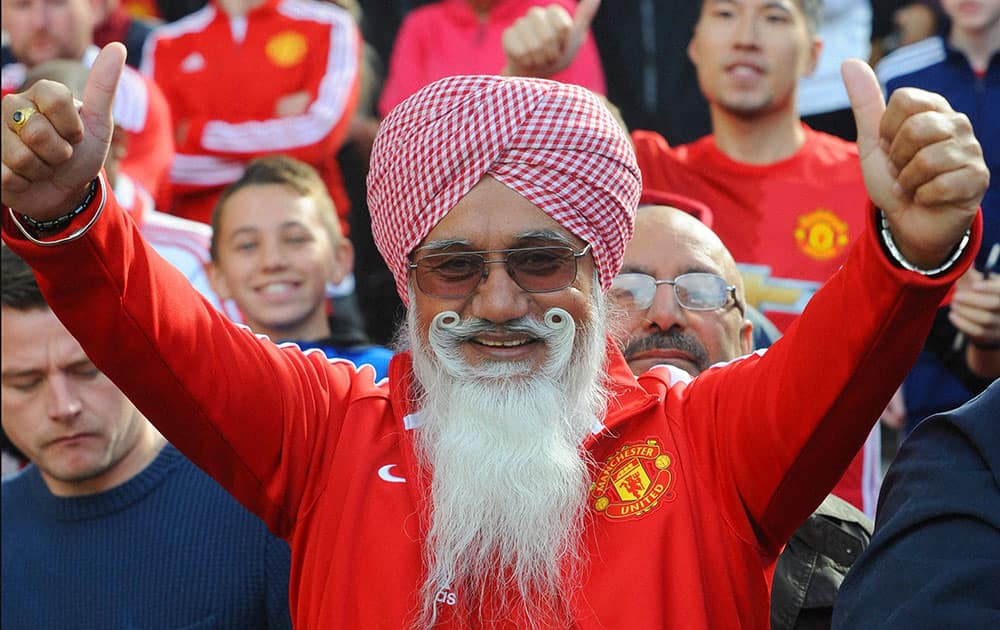  Manchester United fan gestures, during the English Premier League soccer match between Manchester United and Stoke City at Old Trafford in Manchester