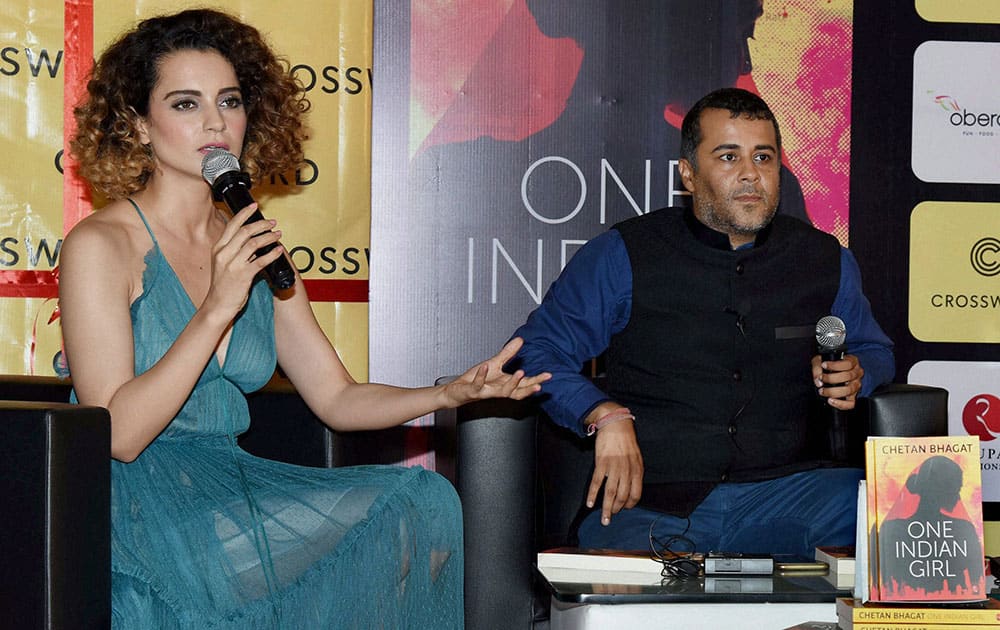 Bollywood actor Kangana Ranaut with author Chetan Bhagat during launch of the book One Indian Girl in Mumbai