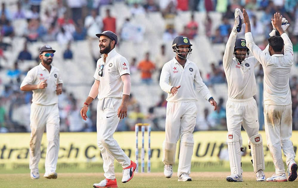 Skipper Virat Kohli with teammates celebrates after Team India won the 2nd Test match against New Zealand, at Eden Garden in Kolkata