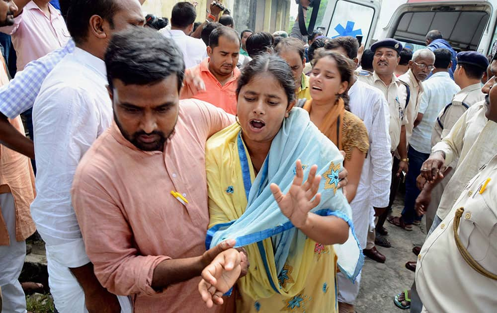 Relatives mourn the death of Mohammad Qyamuddidin, the station house officer of the Kothi police station, in Gaya