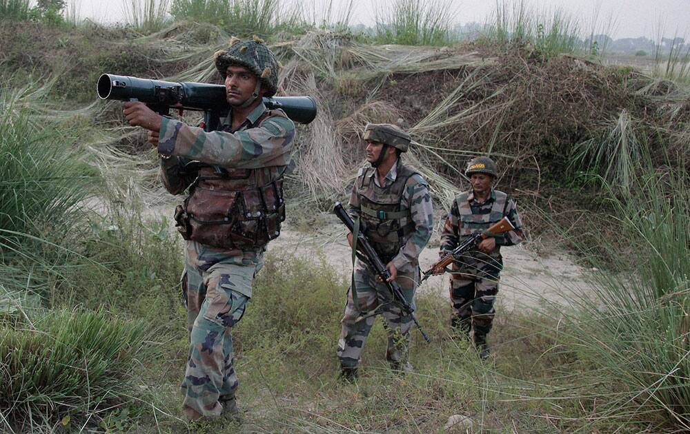 Army soldiers patrol near the highly militarized Line of Control dividing Kashmir between India and Pakistan, in Pallanwal