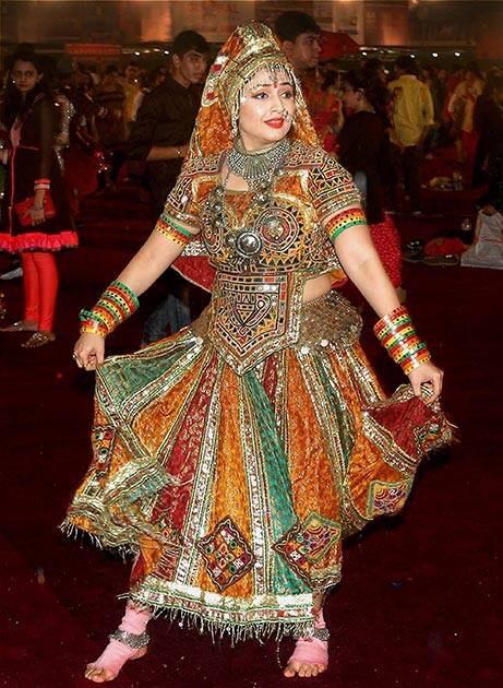 An artist performs Garba Dance