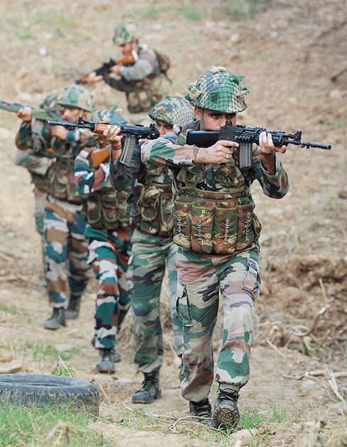 Indian army soldiers patrol near the Line of Control in Pallanwal sector about 70 km from Jammu