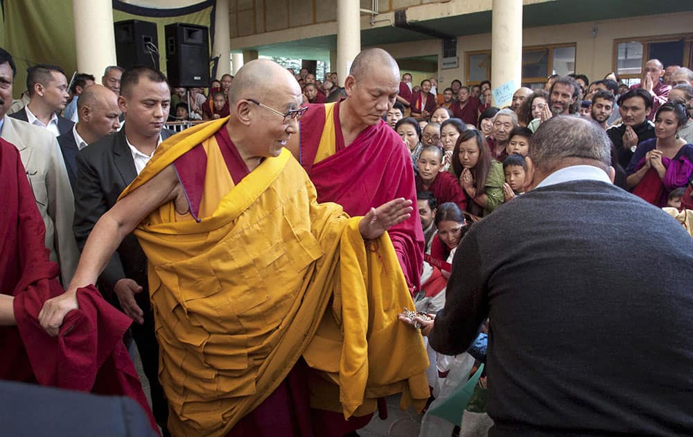 Tibetan Spiritual Leader the Dalai Lama leaves after a preaching session at the Tsugla Khang Temple, Mcleodganj, Dharamshala