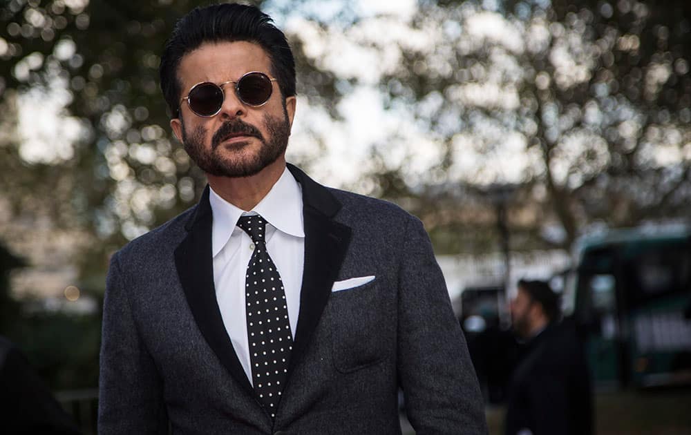 Actor Anil Kapoor poses for photographers upon arrival at the premiere of the film Mirzya at the London Film Festival