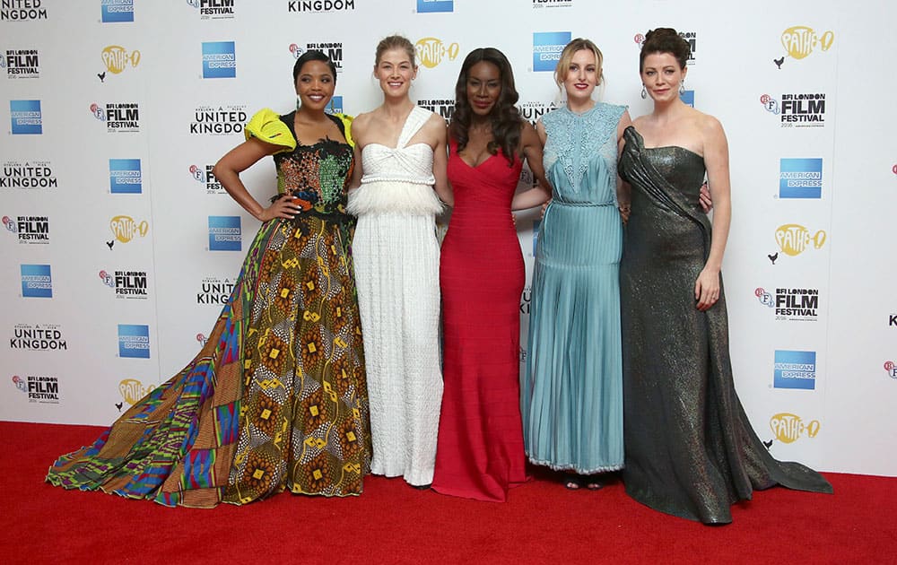 Actresses Terry Pheto, from left, Rosamund Pike, director Amma Asante, actresses Laura Carmichael and Jessica Oyelowo pose for photographers upon arrival at the premiere of the film A United Kingdom, which opens the London Film Festival