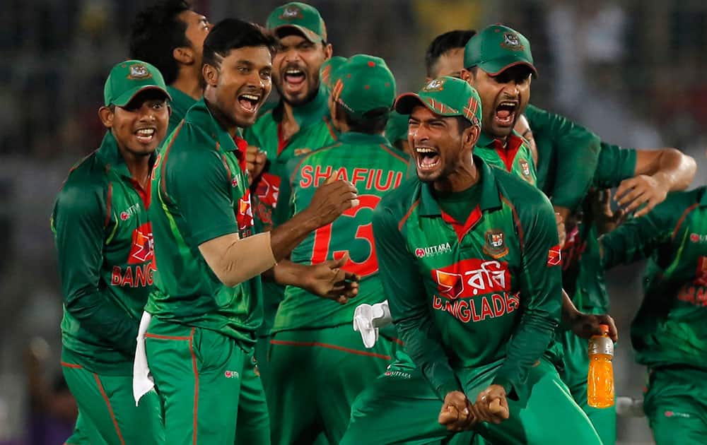 Bangladesh's players celebrate the dismissal of England’s captain Jos Buttler during their second one-day international cricket match in Dhaka, Bangladesh Bangladesh's players celebrate the dismissal of England’s captain Jos Buttler during their second one-day international cricket match in Dhaka, Bangladesh