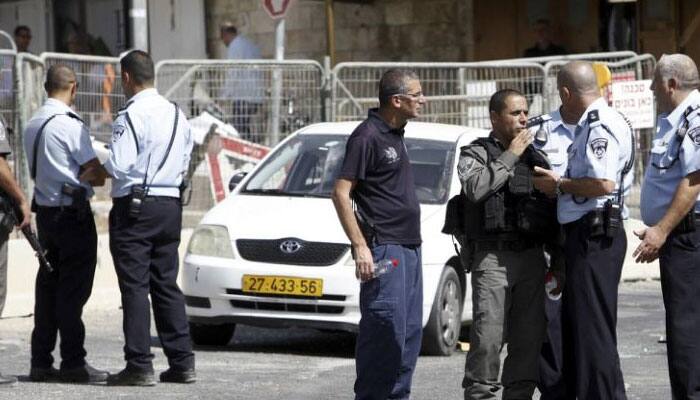 Israel arrests dozens of Palestinians after shooting rampage