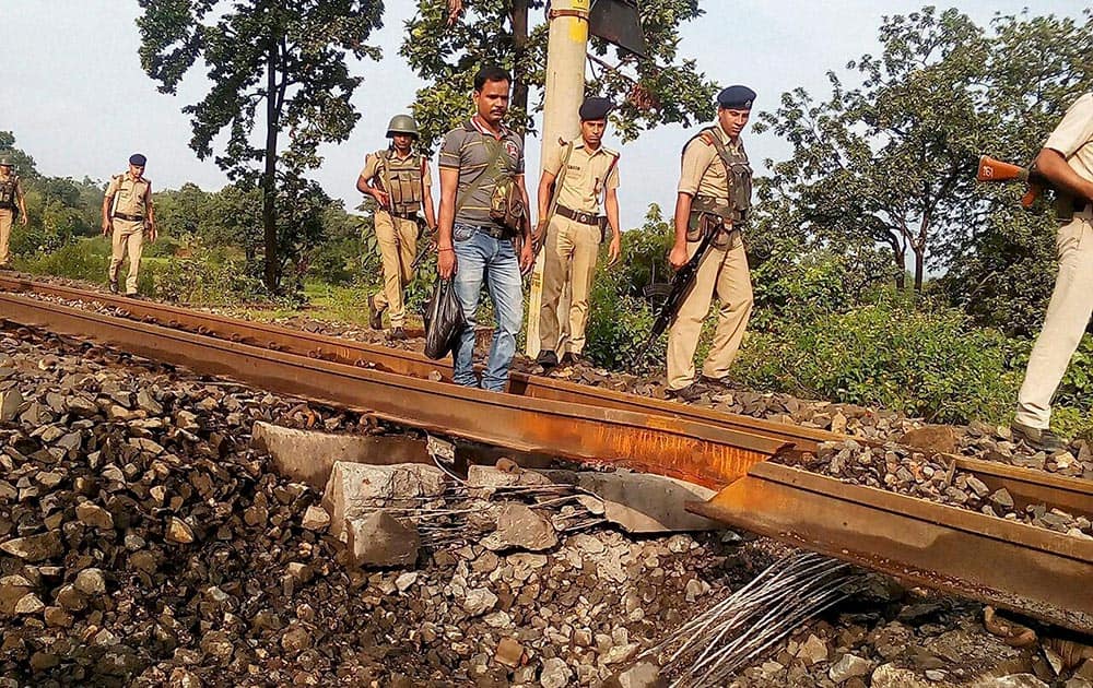 Police personnel investigate after Naxals blasted