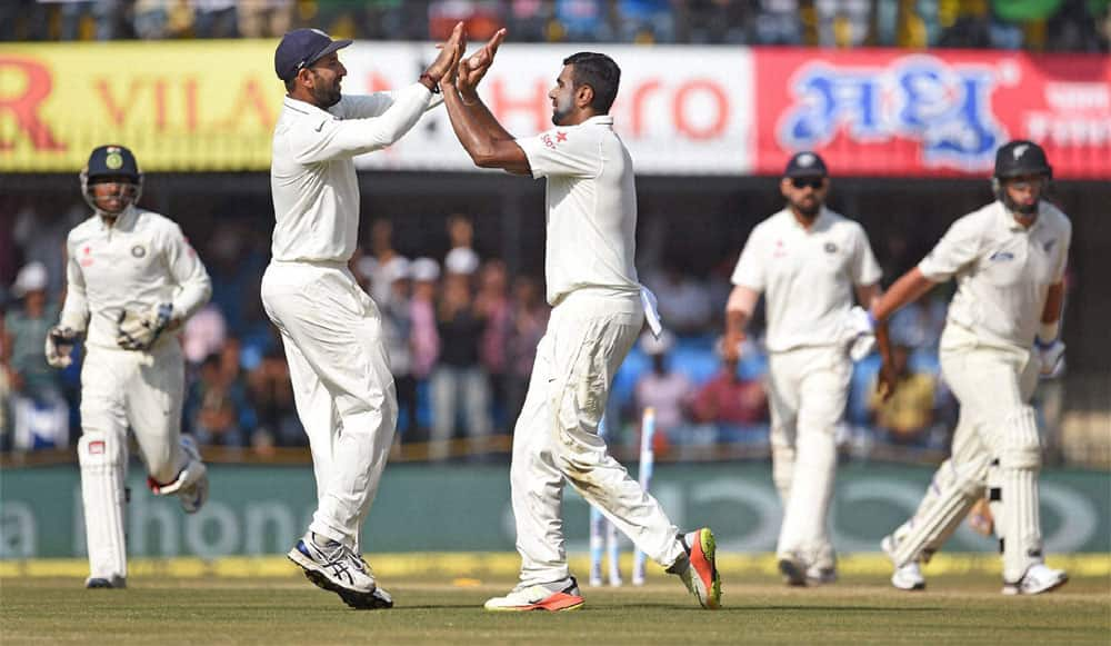 R Ashiwin with Cheteswar Pujara celebrates