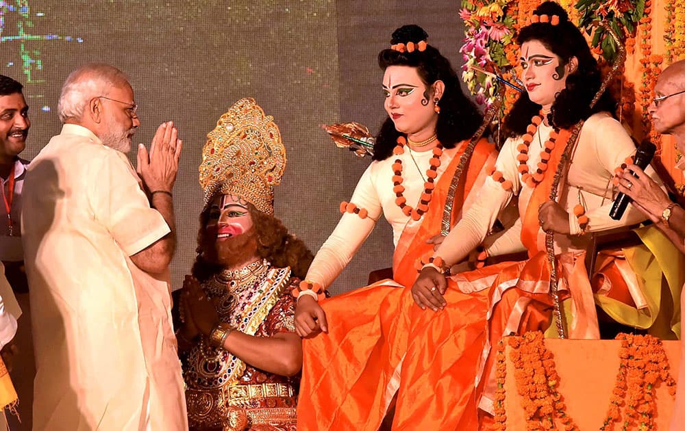 Prime Minister Narendra Modi with artists enacting Lord Rama and Lakshman during Dussehra celebrations at Aishbagh Ram Leela in Lucknow